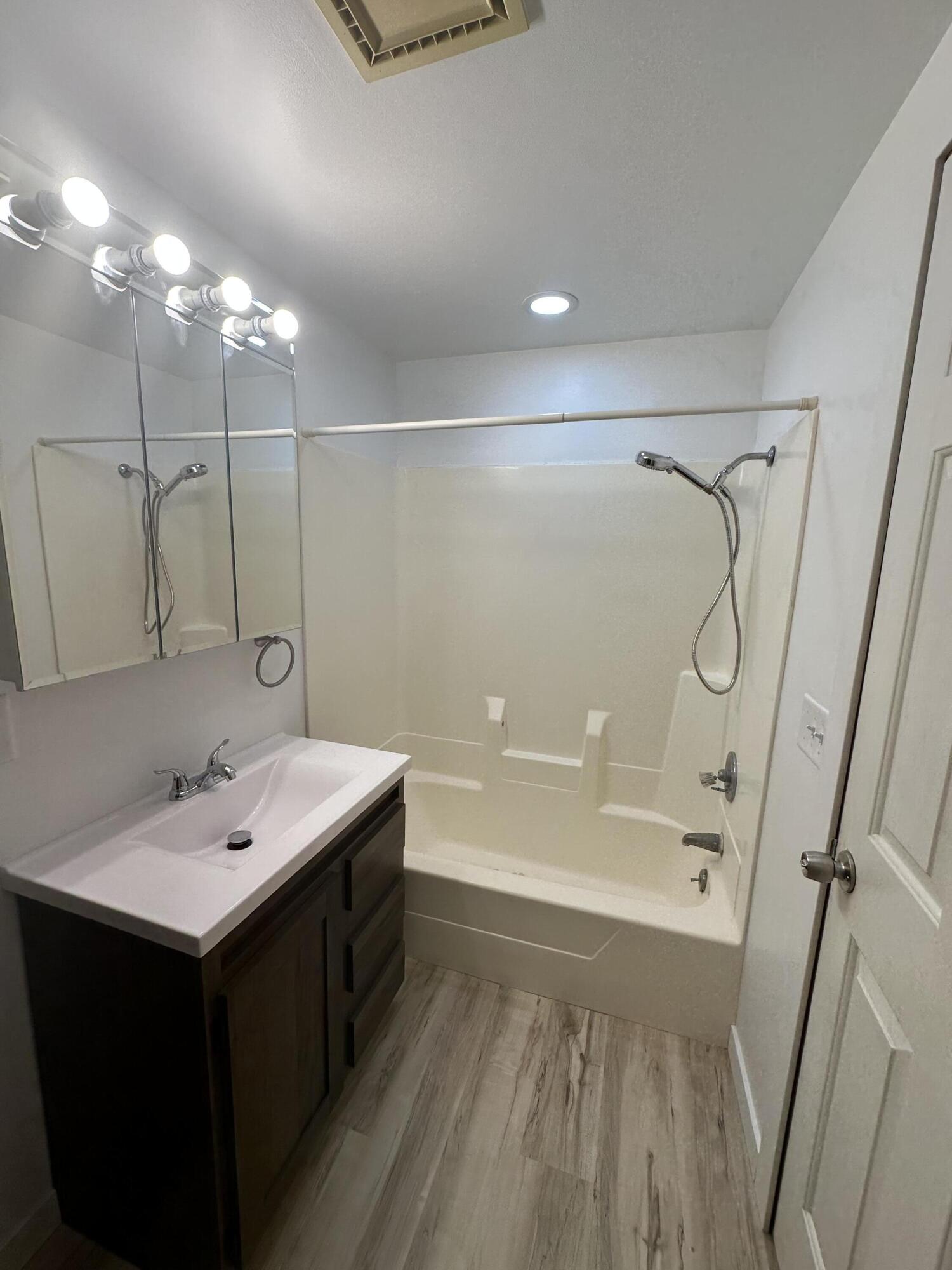 806 Maple Avenue La Porte, IN 46350 - Photo 9 of 9 a bathroom with a shower sink vanity and mirror