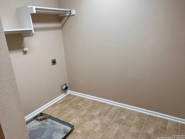 a bathroom with a sink a toilet a mirror and shower