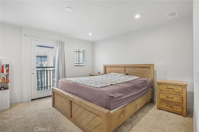 a bedroom with a bed and a cabinets