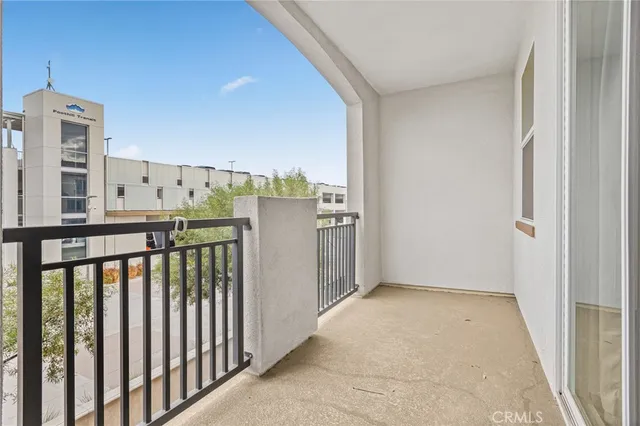 a view of a balcony with furniture