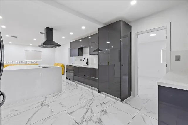 a kitchen with a sink and cabinets