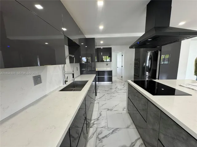 a living room with furniture kitchen view and a table