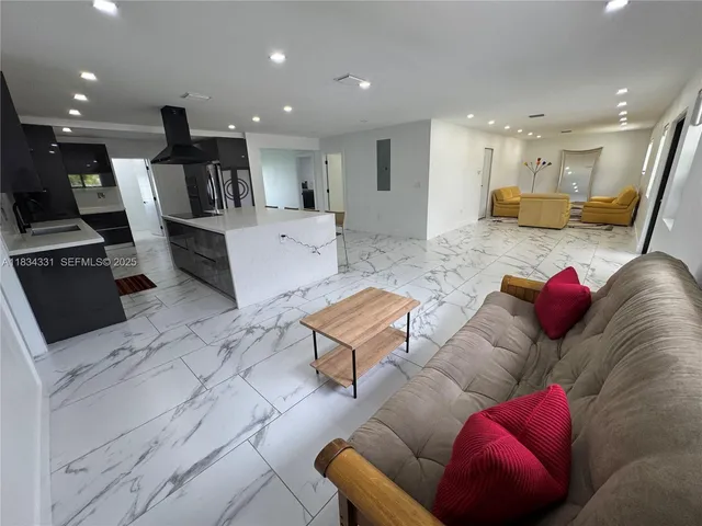 a bedroom with a bed and a ceiling fan