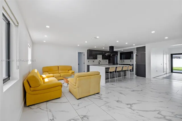 a bedroom with a bed and a television