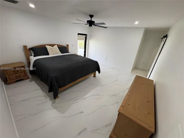 a bathroom with a shower and toilet