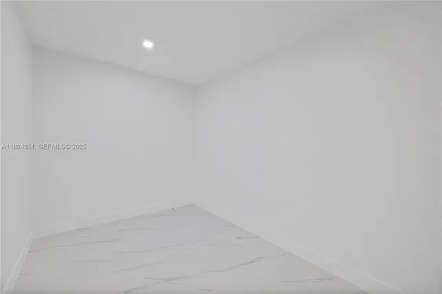 a bathroom with a shower a sink a toilet and mirror