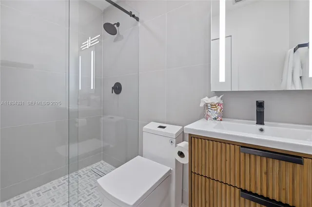 a living room with furniture and a mirror