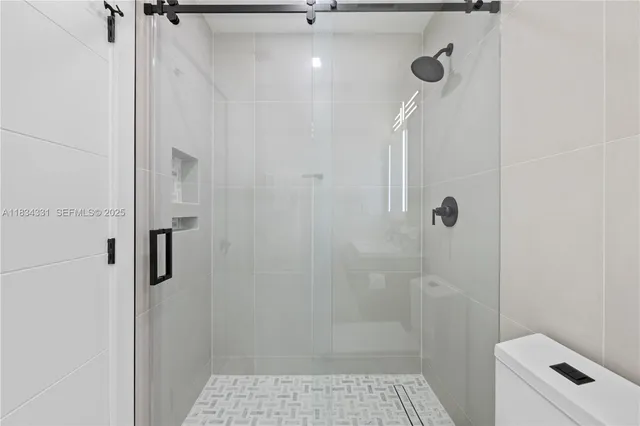 a bathroom with a toilet and a sink