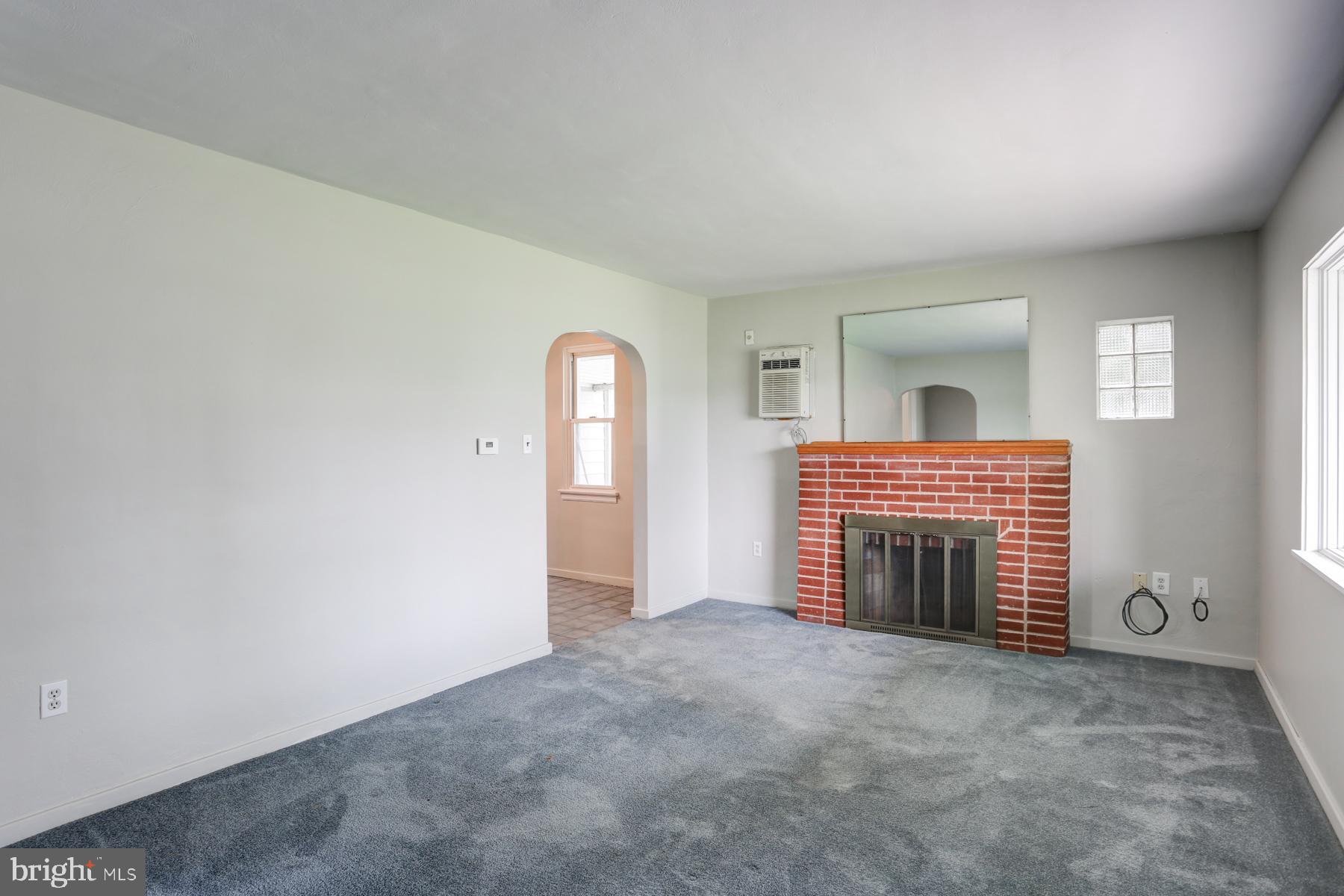 1384 Simpson Ferry Road New Cumberland, PA 17070 - Photo 4 of 23 Living room with brick fireplace