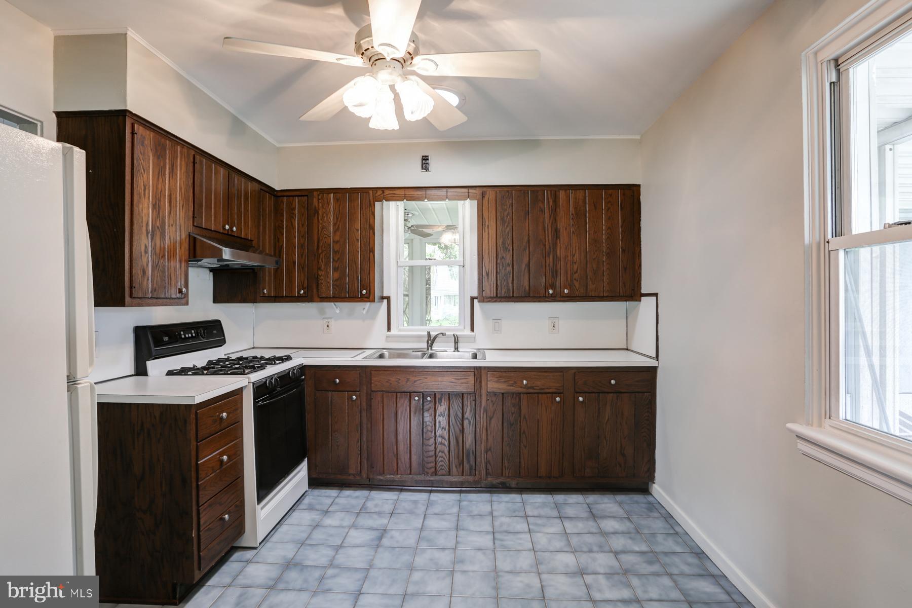 1384 Simpson Ferry Road New Cumberland, PA 17070 - Photo 7 of 23 Kitchen with ceramic tile floors and gas range