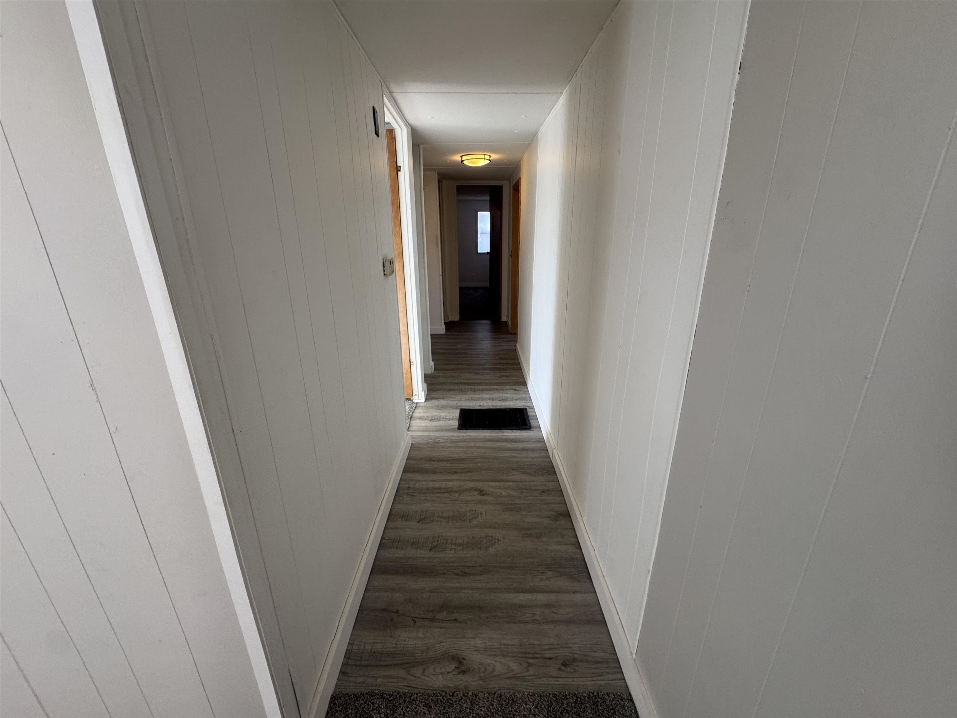 409 West 9th Street Sandoval, IL 62882 - Photo 12 of 31 a view of a hallway with wooden floor and entryway