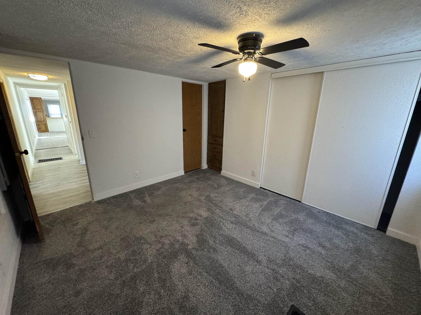 409 West 9th Street Sandoval, IL 62882 - Photo 19 of 31 a view of a hallway with a chandelier fan