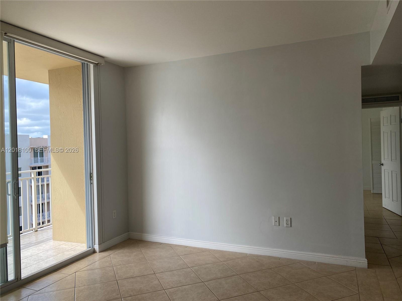2425 Southwest 27th Avenue, Unit 1008 Miami, FL 33145 - Photo 13 of 20 a view of an empty room and fire place