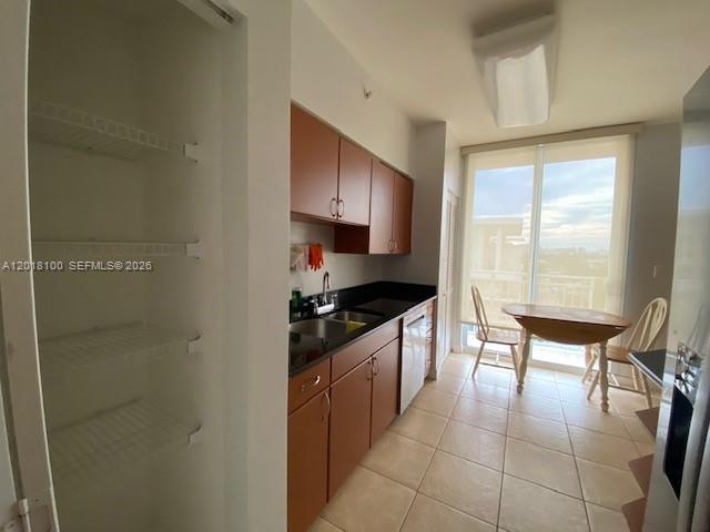 2425 Southwest 27th Avenue, Unit 1008 Miami, FL 33145 - Photo 15 of 20 a kitchen with stainless steel appliances granite countertop a sink and a stove