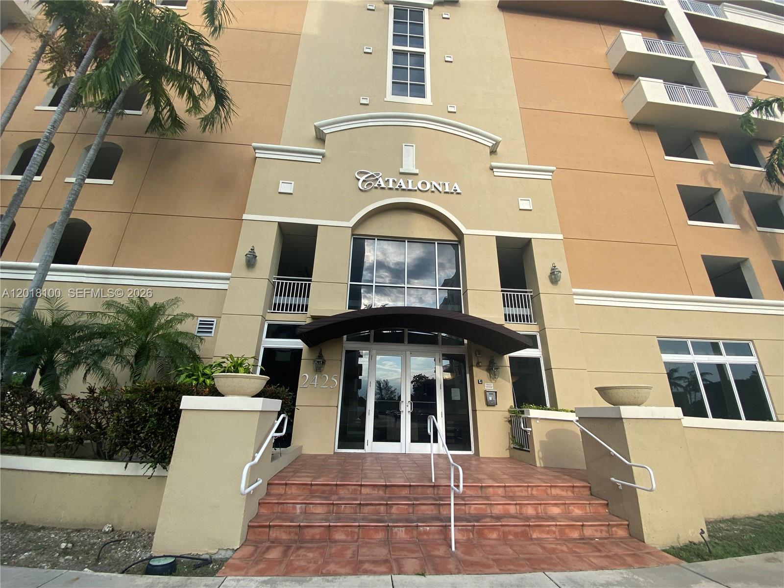 2425 Southwest 27th Avenue, Unit 1008 Miami, FL 33145 - Photo 4 of 20 a front view of a multi story residential apartment building