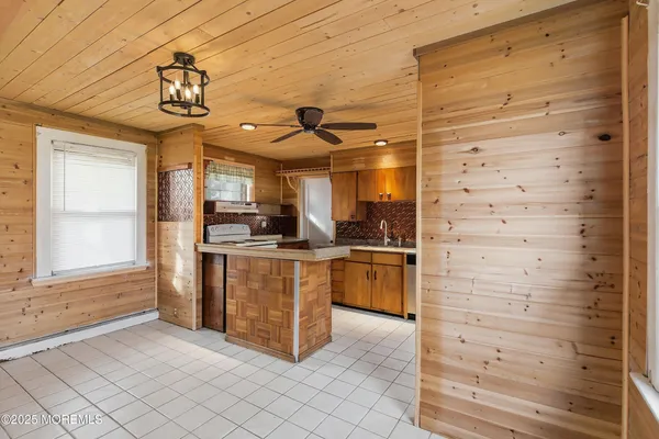 a kitchen with cabinets and window