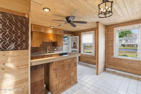 a kitchen with stainless steel appliances granite countertop a sink and cabinets