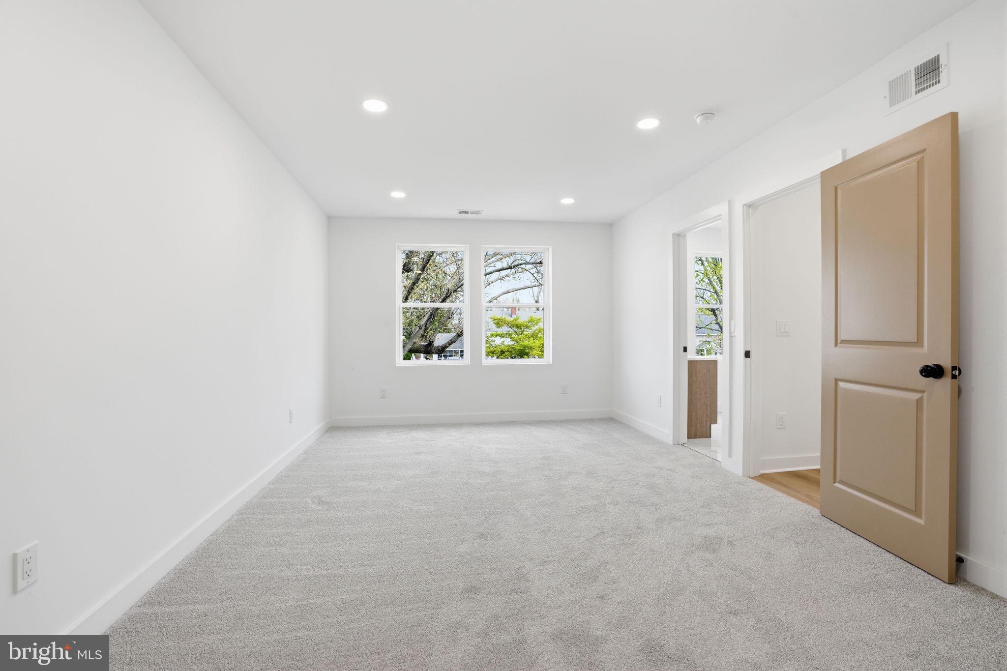 14 Inlet Road Levittown, PA 19057 - Photo 16 of 31 an empty room with windows and closet