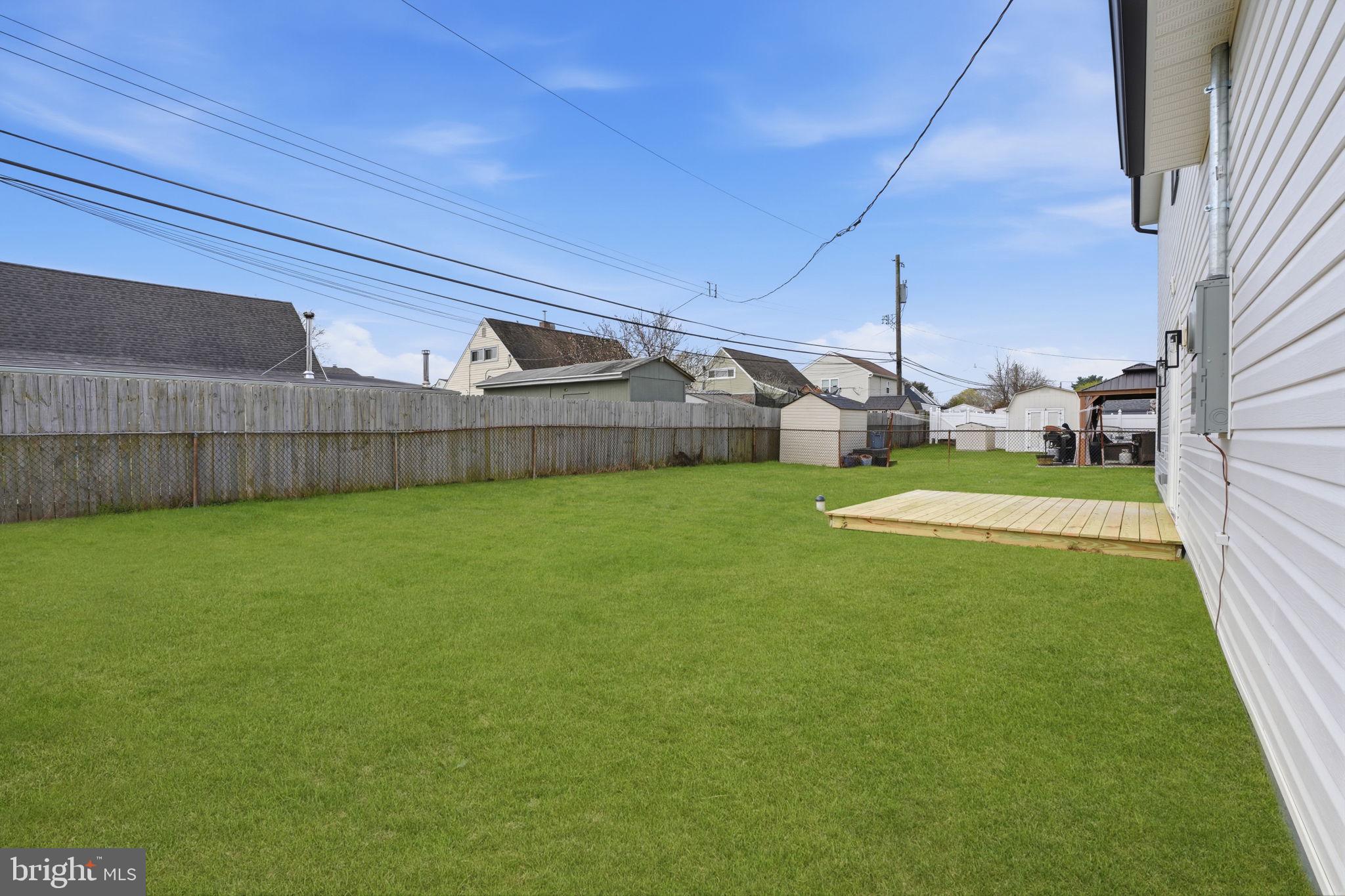 14 Inlet Road Levittown, PA 19057 - Photo 28 of 31 a view of a back yard of the house