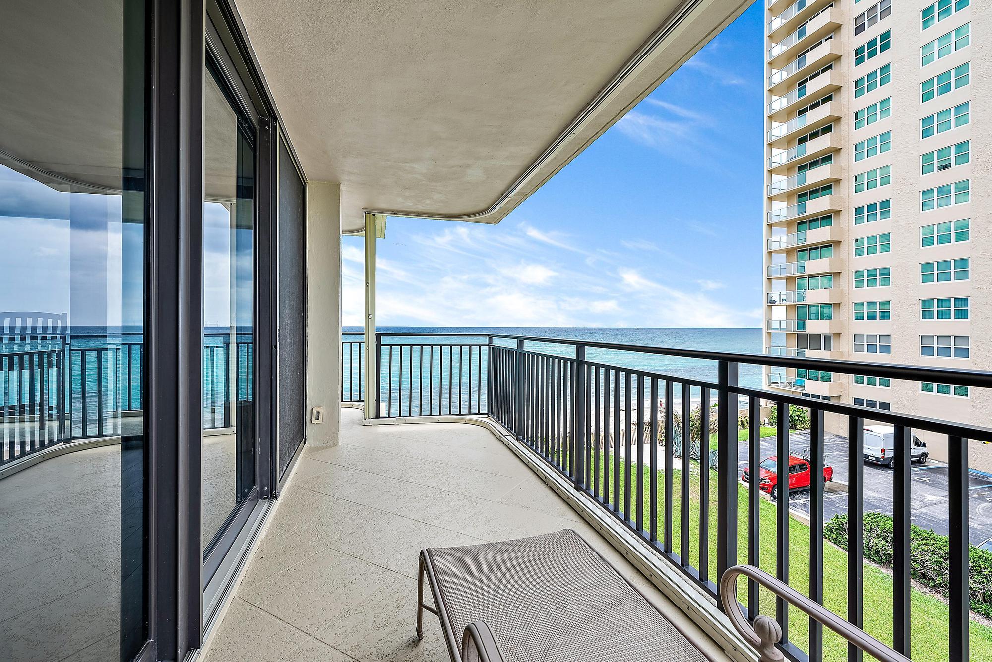 5460 North Ocean Drive, Unit 3B Riviera Beach, FL 33404 - Photo 11 of 26 a balcony with a floor to ceiling window