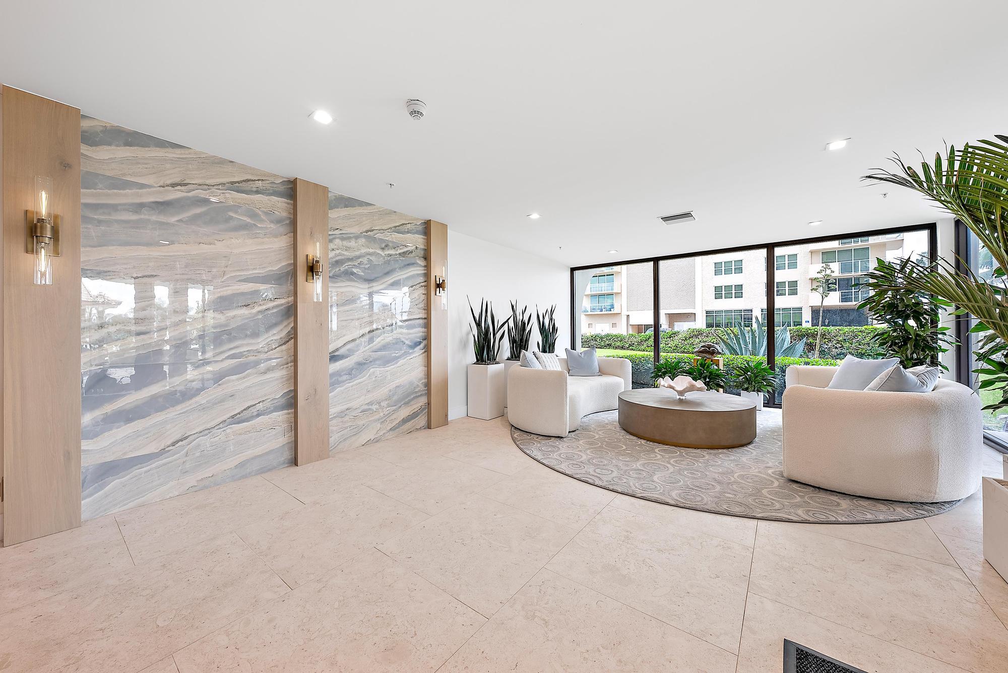 5460 North Ocean Drive, Unit 3B Riviera Beach, FL 33404 - Photo 21 of 26 a living room with furniture and a potted plant