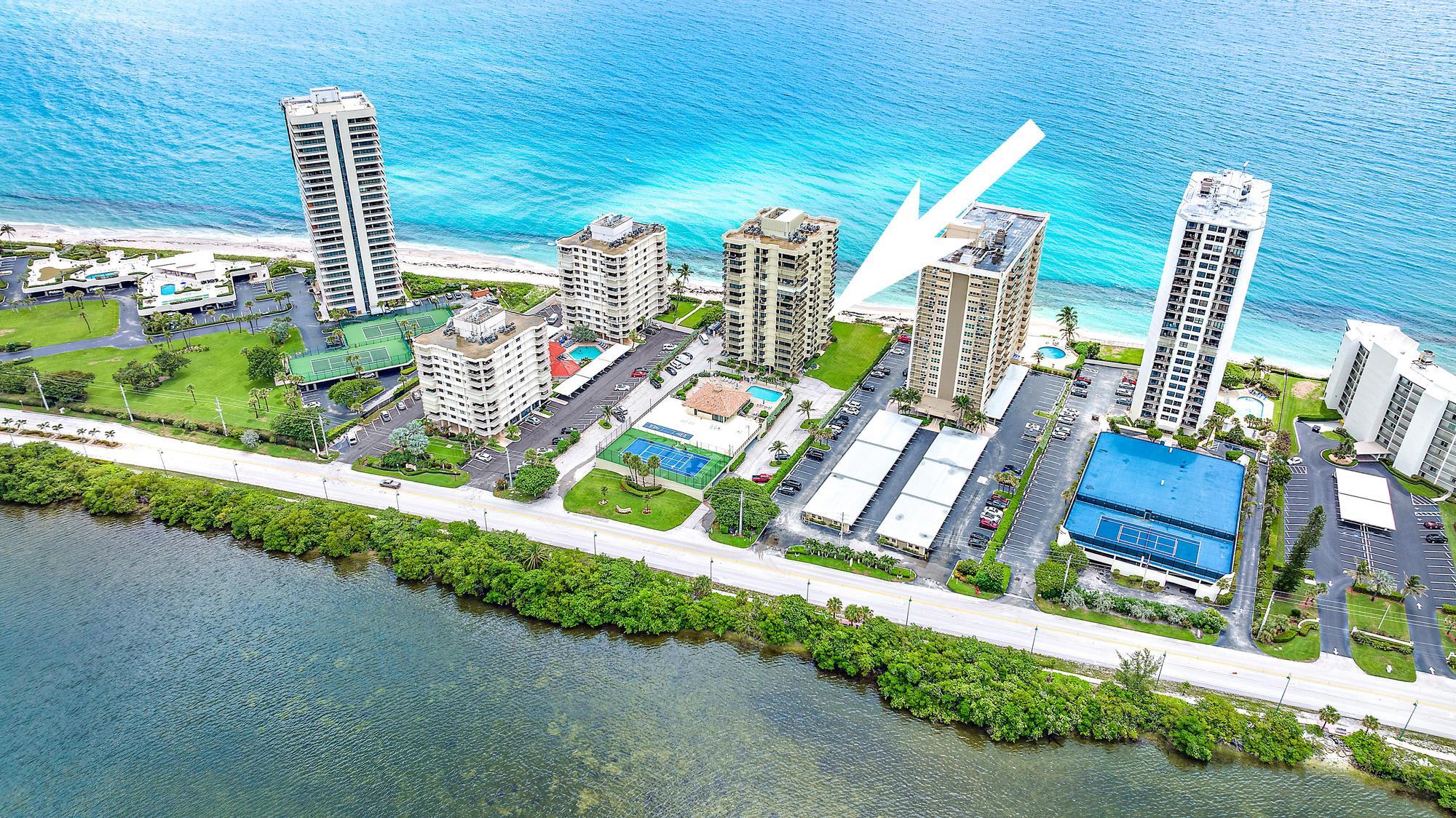 5460 North Ocean Drive, Unit 3B Riviera Beach, FL 33404 - Photo 23 of 26 a front view of a house with garden