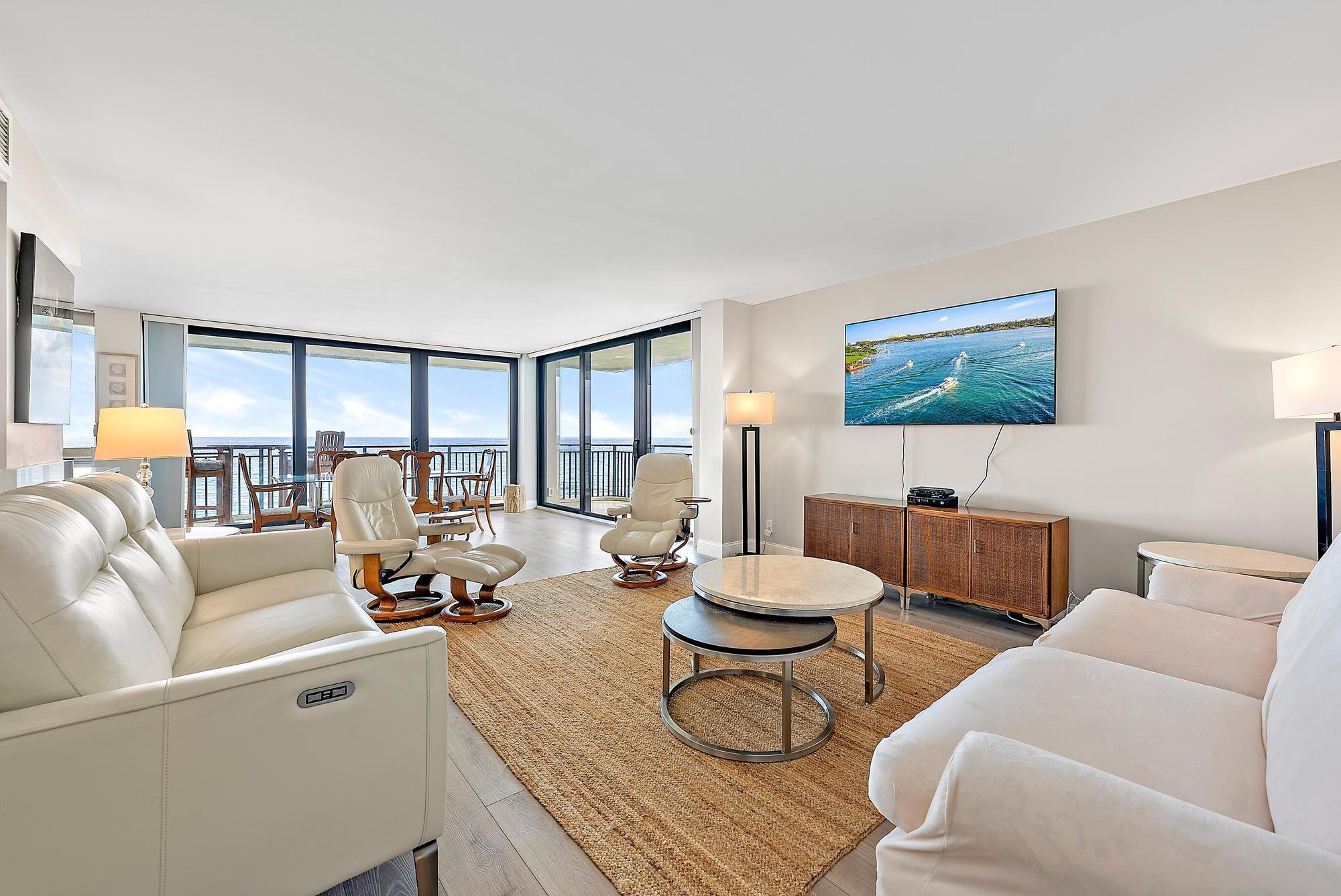 5460 North Ocean Drive, Unit 3B Riviera Beach, FL 33404 - Photo 8 of 26 a living room with furniture and a flat screen tv