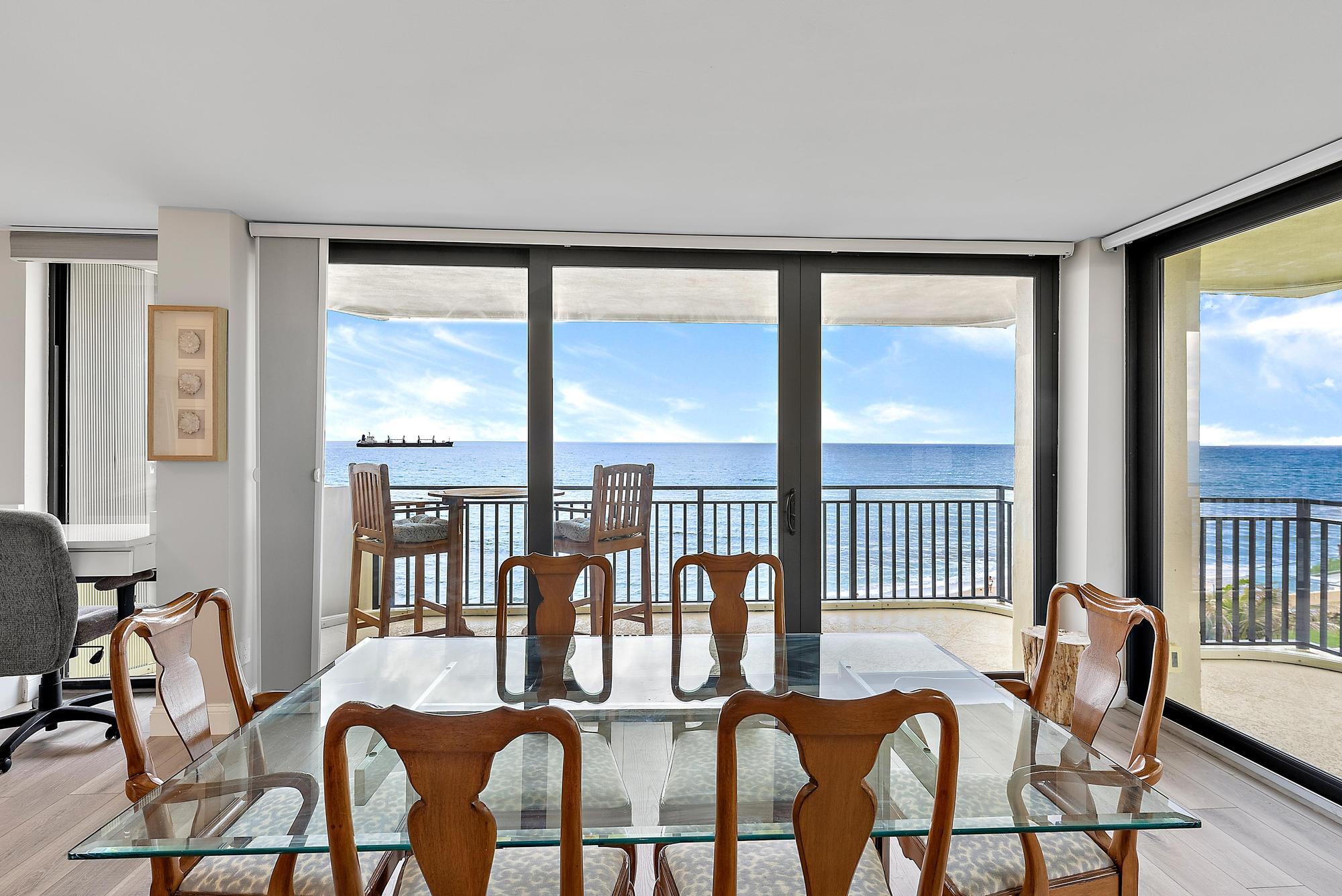 5460 North Ocean Drive, Unit 3B Riviera Beach, FL 33404 - Photo 10 of 26 a dining room with furniture water view and a floor to ceiling window
