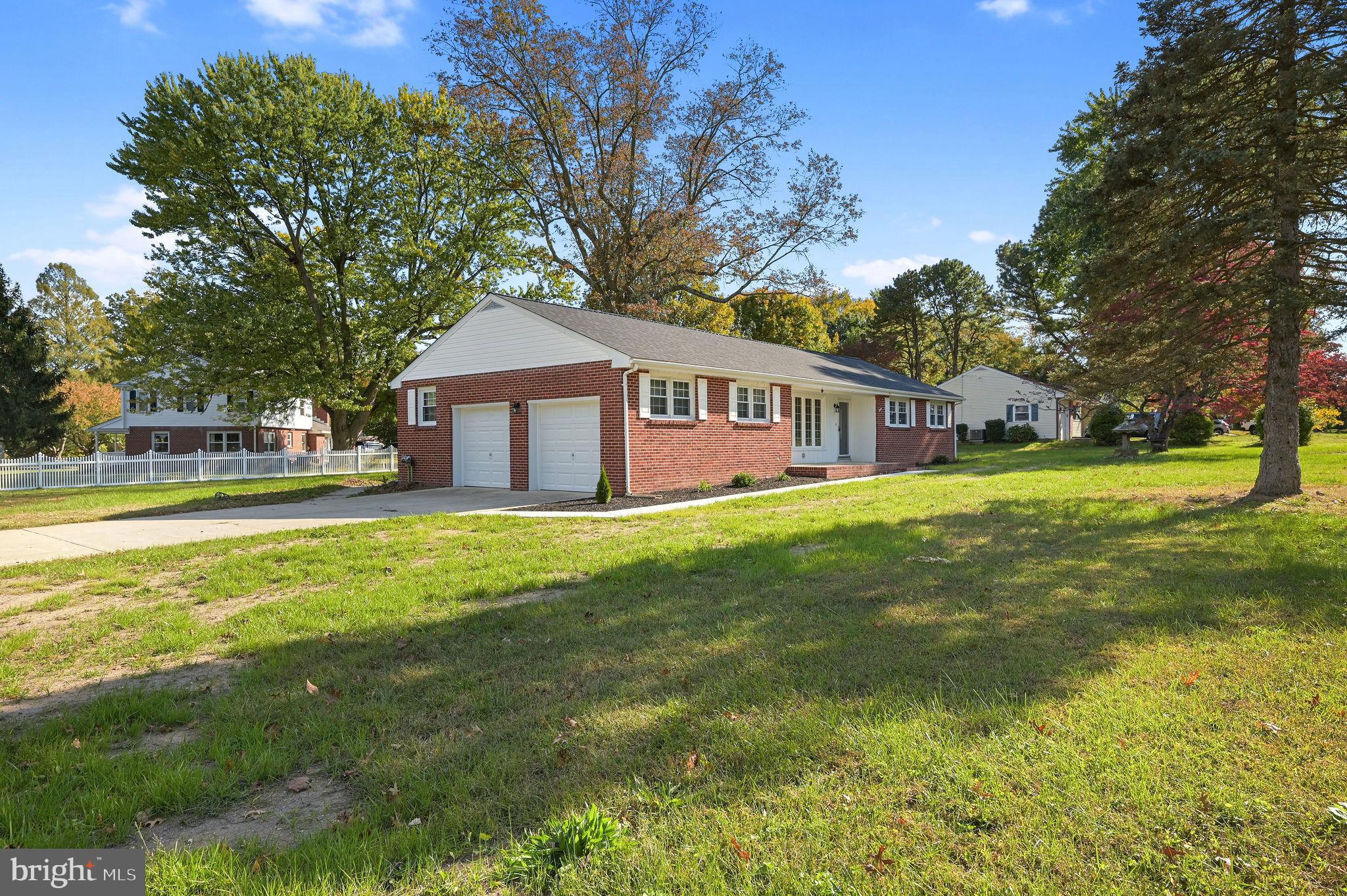 201 North Old Mill Road Dover, DE 19901 - Photo 1 of 27 a view of a house with a big yard and palm trees