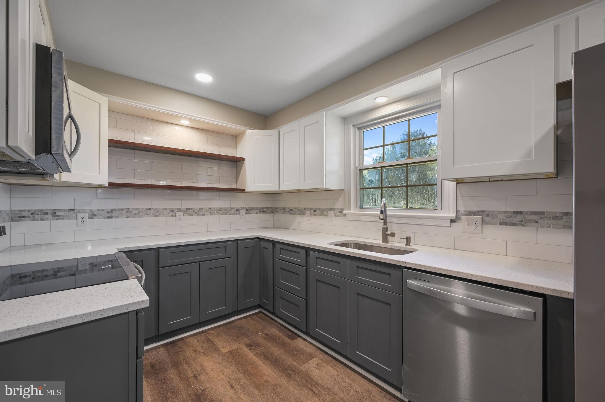 201 North Old Mill Road Dover, DE 19901 - Photo 11 of 27 a kitchen with a sink and cabinets