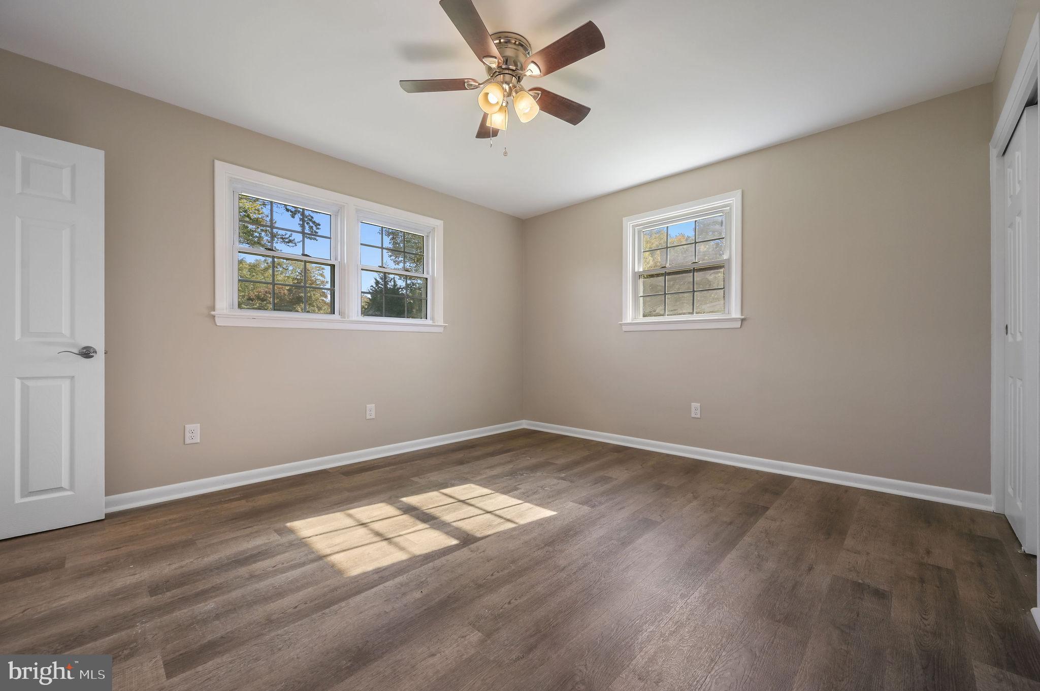 201 North Old Mill Road Dover, DE 19901 - Photo 17 of 27 a view of empty room with wooden floor and fan