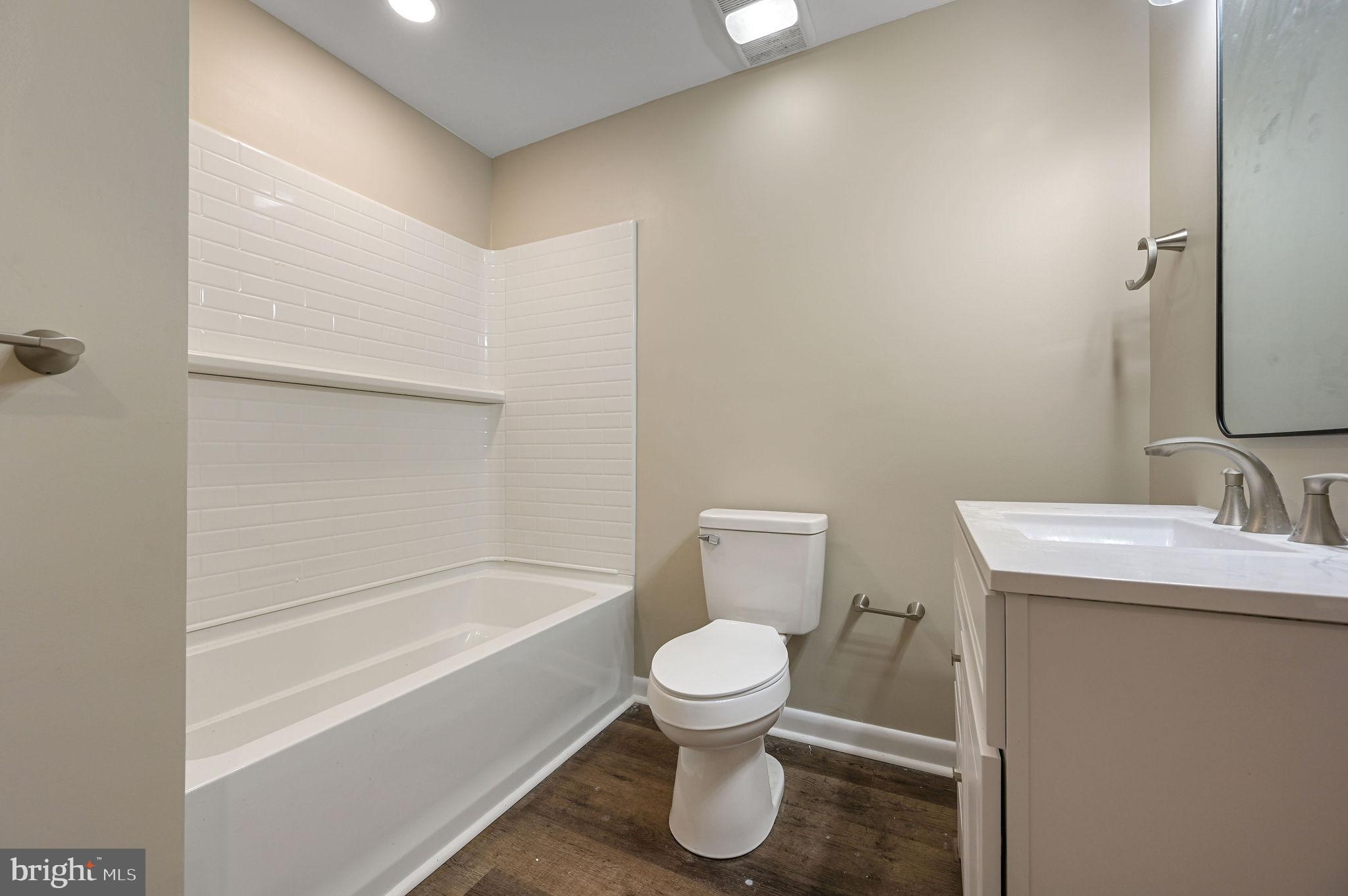 201 North Old Mill Road Dover, DE 19901 - Photo 20 of 27 a bathroom with a toilet and a sink