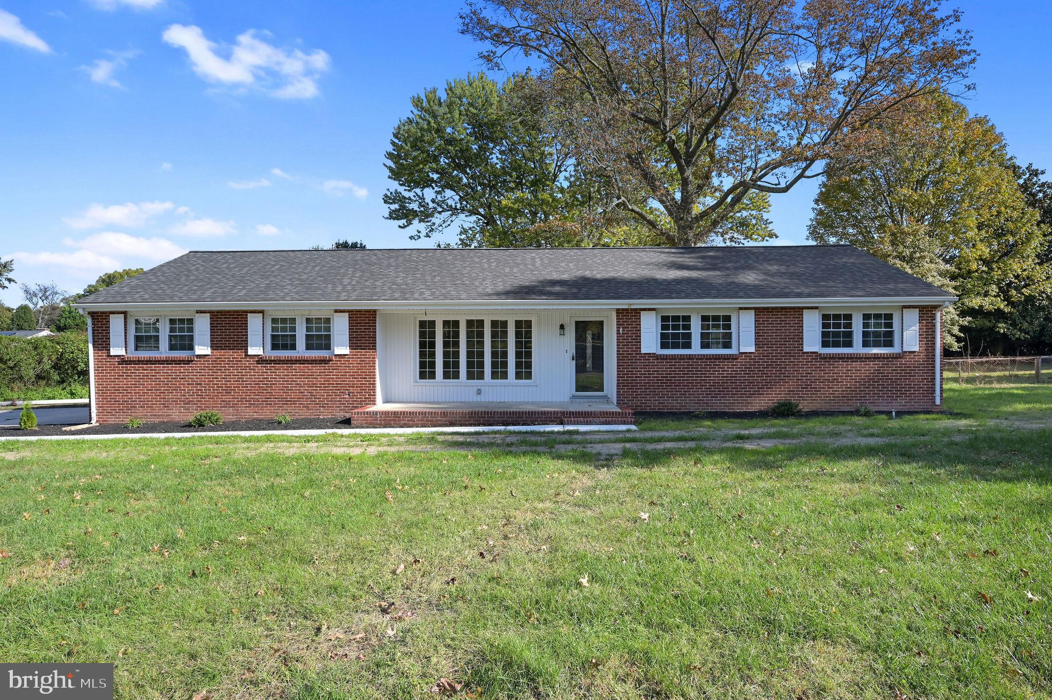201 North Old Mill Road Dover, DE 19901 - Photo 2 of 27 a view of a yard in front of a house with large trees