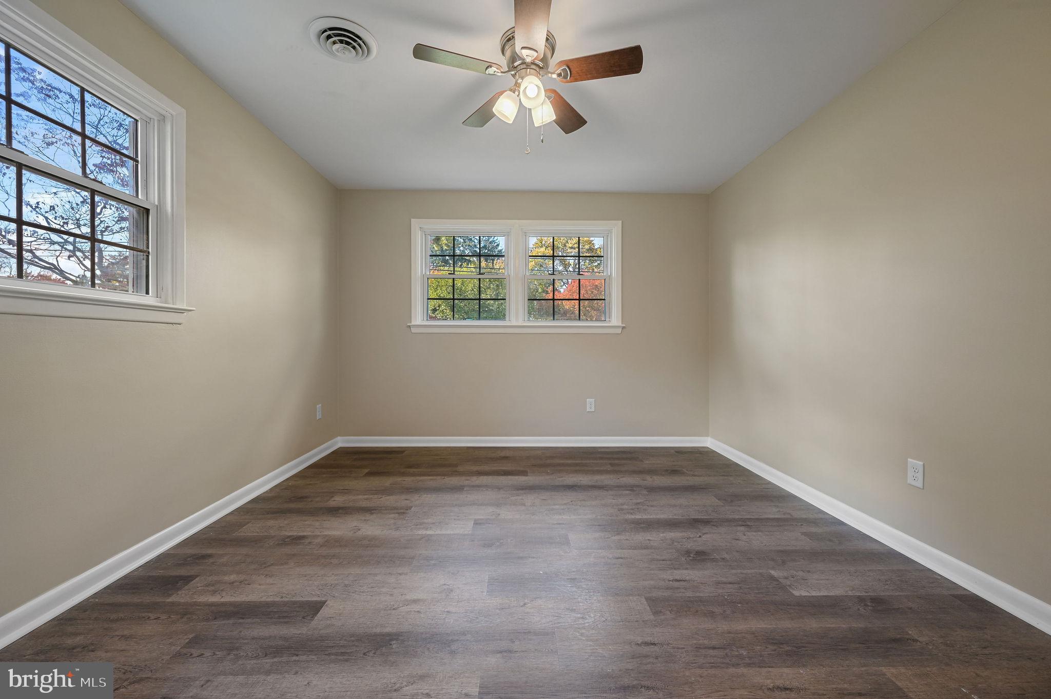 201 North Old Mill Road Dover, DE 19901 - Photo 21 of 27 wooden floor in an empty room with a window