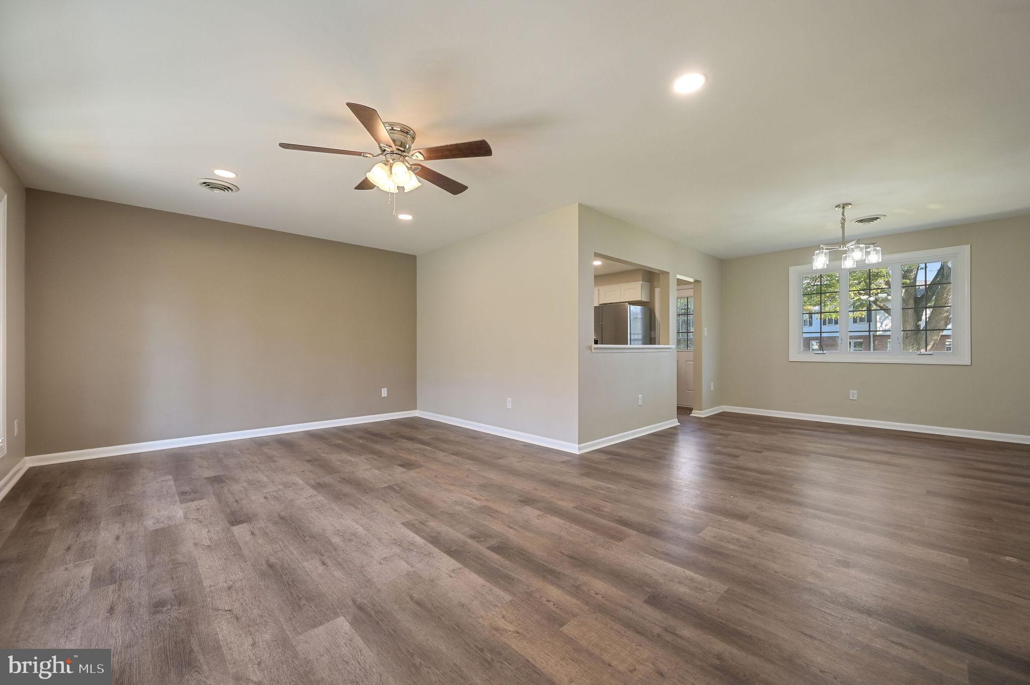 201 North Old Mill Road Dover, DE 19901 - Photo 3 of 27 a view of an empty room with window and wooden floor