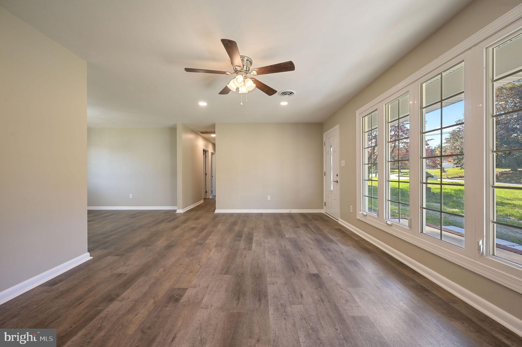 201 North Old Mill Road Dover, DE 19901 - Photo 6 of 27 a view of an empty room with wooden floor and a window