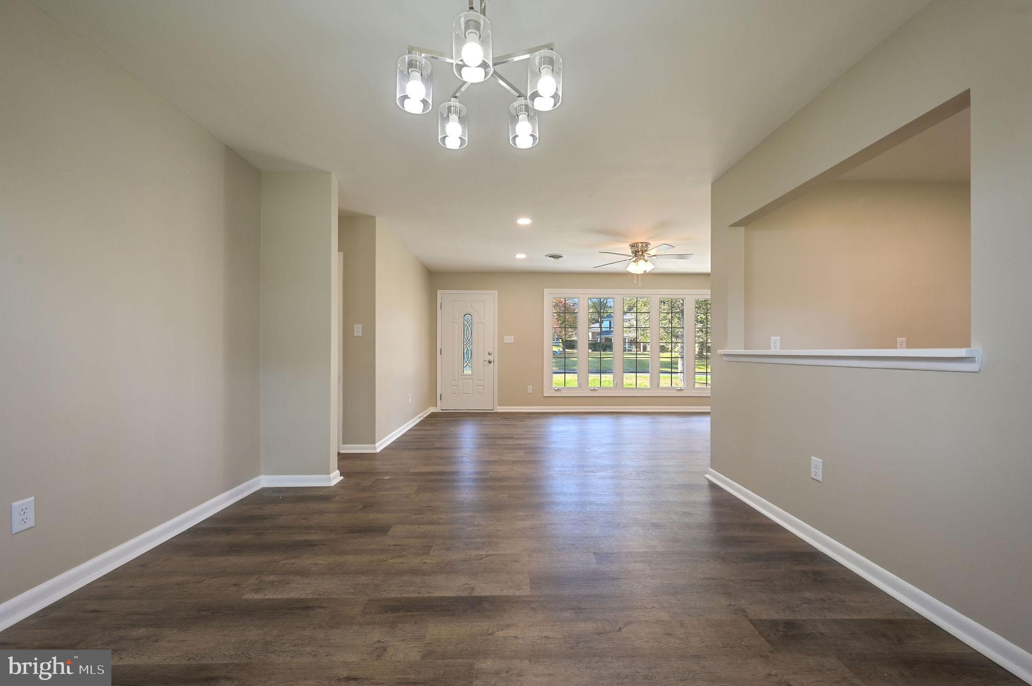 201 North Old Mill Road Dover, DE 19901 - Photo 8 of 27 a view of an empty room with window and wooden floor