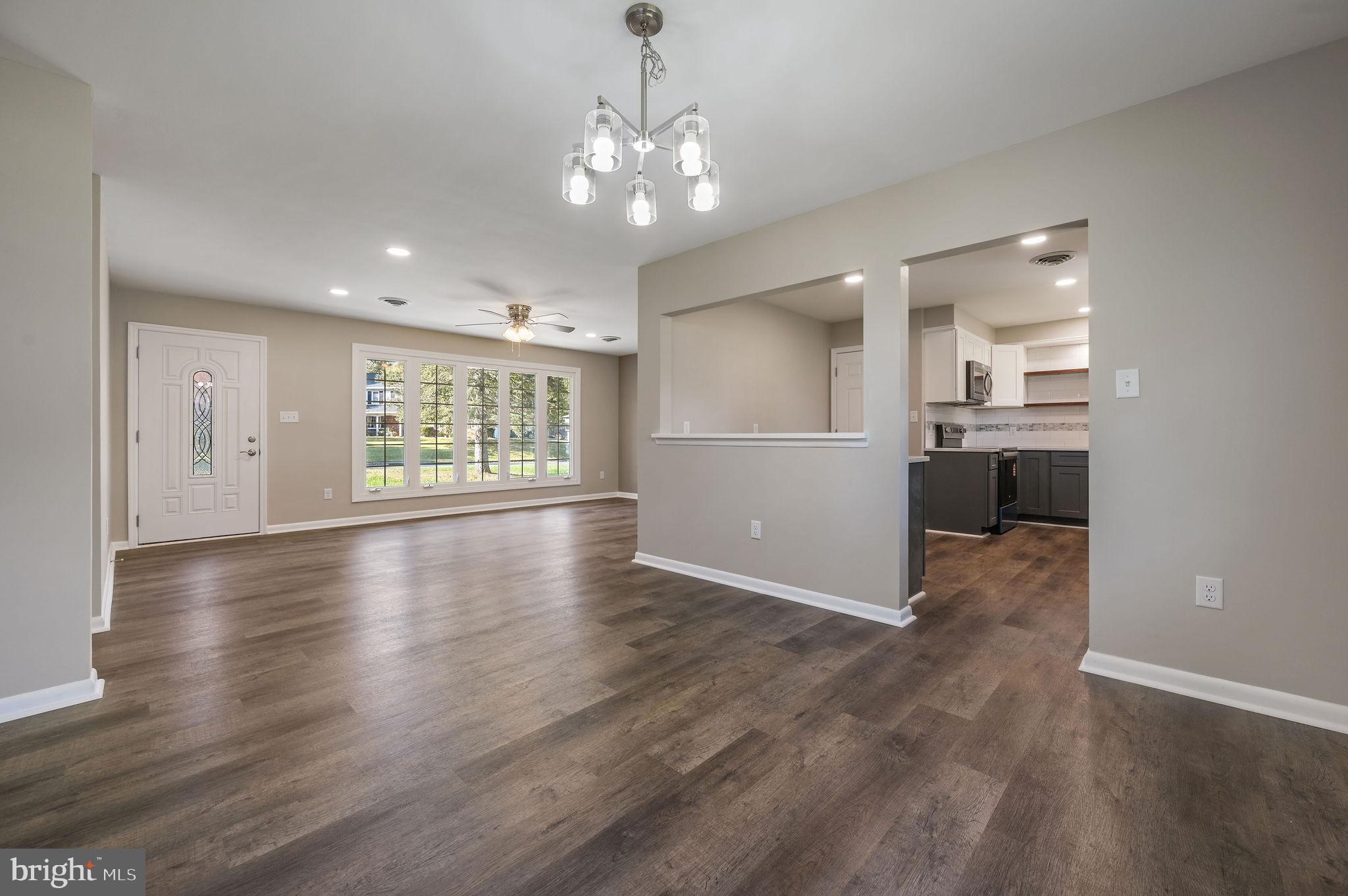 201 North Old Mill Road Dover, DE 19901 - Photo 10 of 27 a view of a livingroom with furniture wooden floor and kitchen