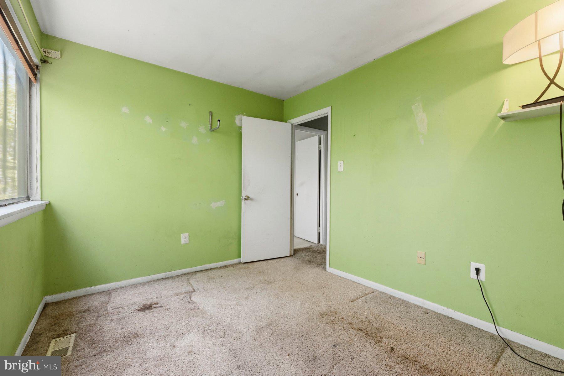 10669 Spring Oak Court Burke, VA 22015 - Photo 19 of 30 Vibrant green room awaiting transformation.