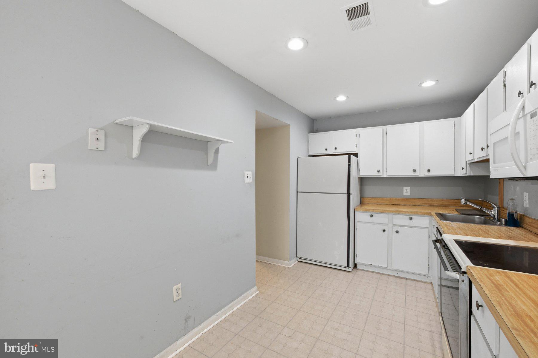 10669 Spring Oak Court Burke, VA 22015 - Photo 6 of 30 Bright and functional kitchen space.