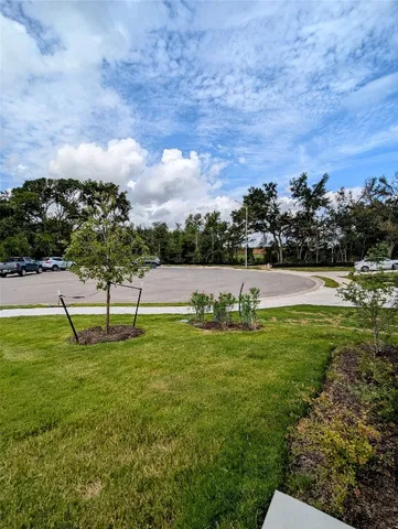 a large kitchen with sink a counter top space stainless steel appliances and cabinets