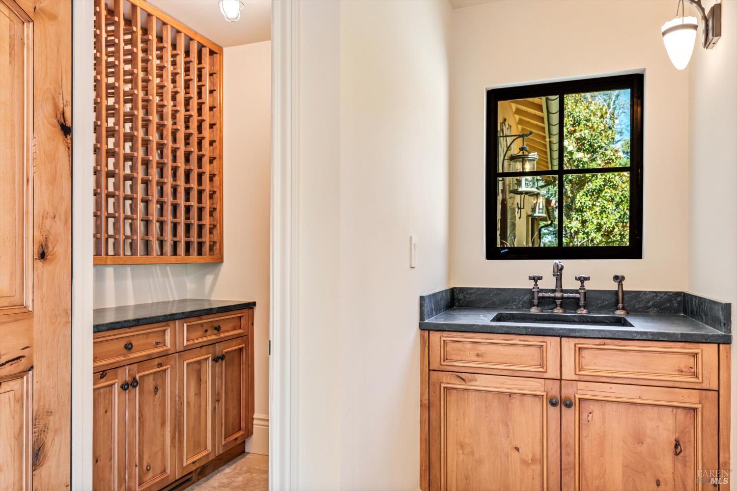 1315 West Dry Creek Road Healdsburg, CA 95448 - Photo 11 of 57 a close view of a sink and a mirror
