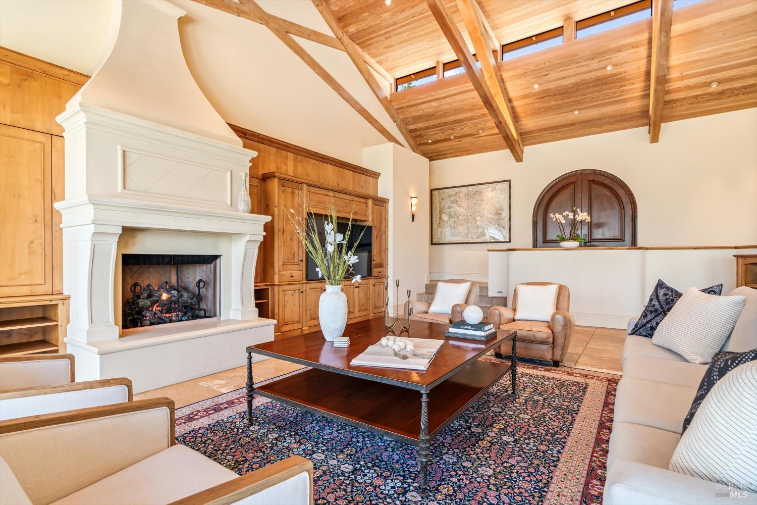1315 West Dry Creek Road Healdsburg, CA 95448 - Photo 20 of 57 a living room with furniture a fireplace and next to a window