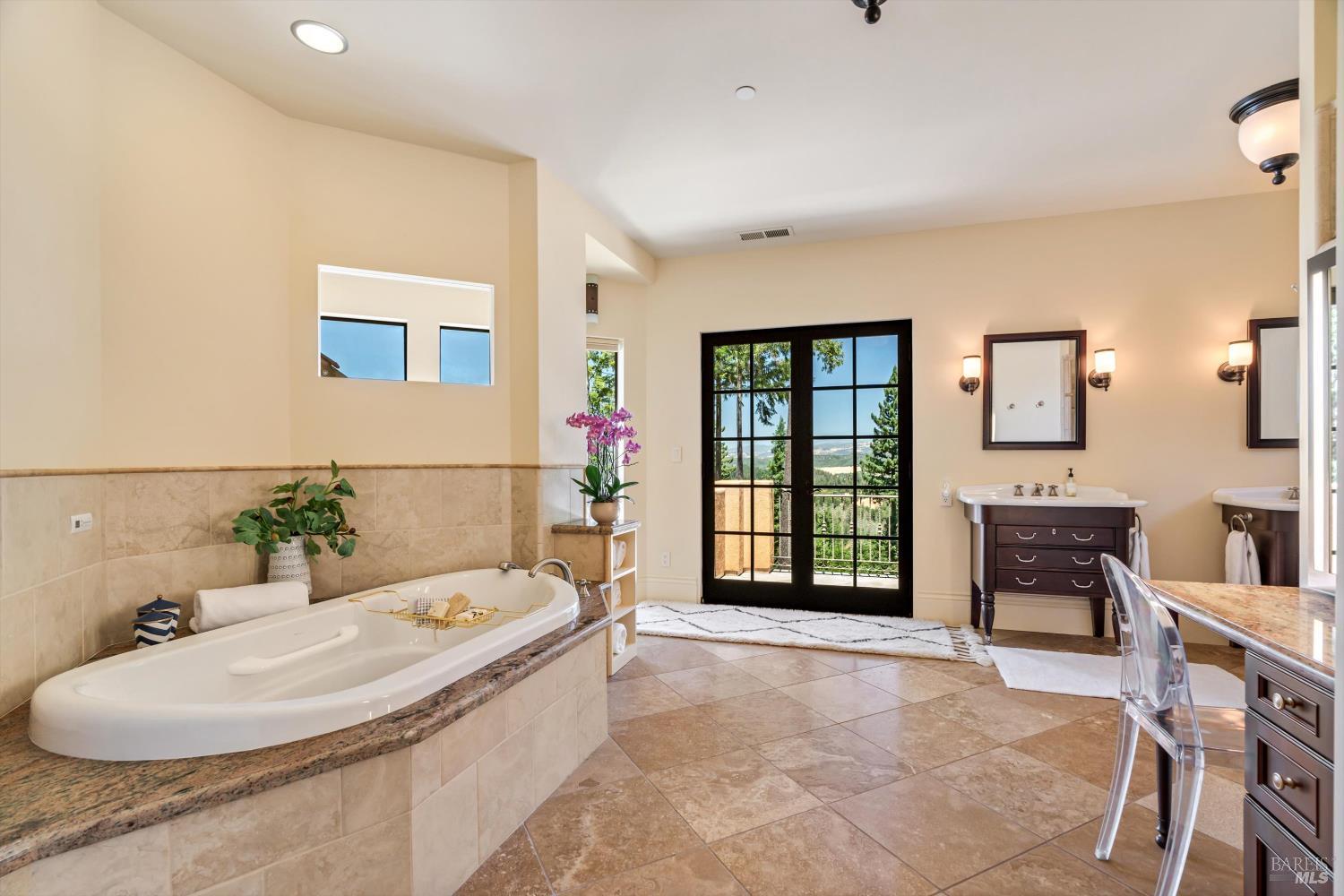 1315 West Dry Creek Road Healdsburg, CA 95448 - Photo 26 of 57 a bathroom with a tub sink and mirror