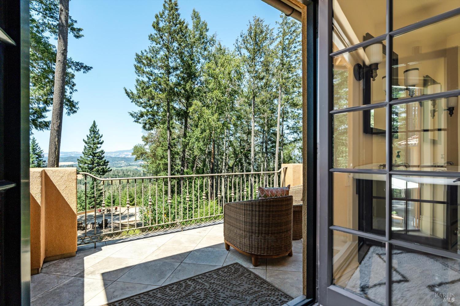 1315 West Dry Creek Road Healdsburg, CA 95448 - Photo 27 of 57 a view of a balcony with chairs and wooden fence