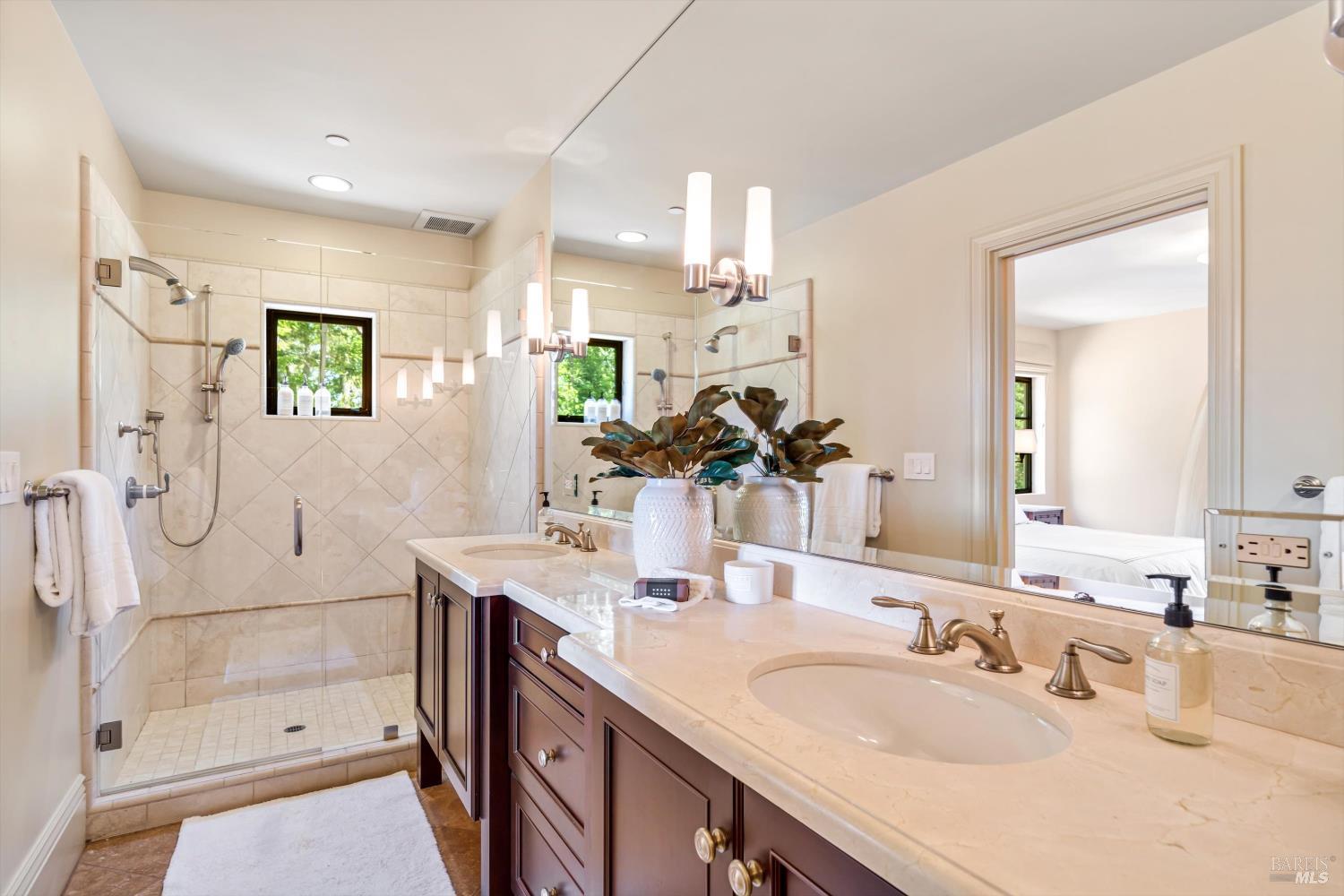 1315 West Dry Creek Road Healdsburg, CA 95448 - Photo 29 of 57 a bathroom with a granite countertop sink mirror and shower
