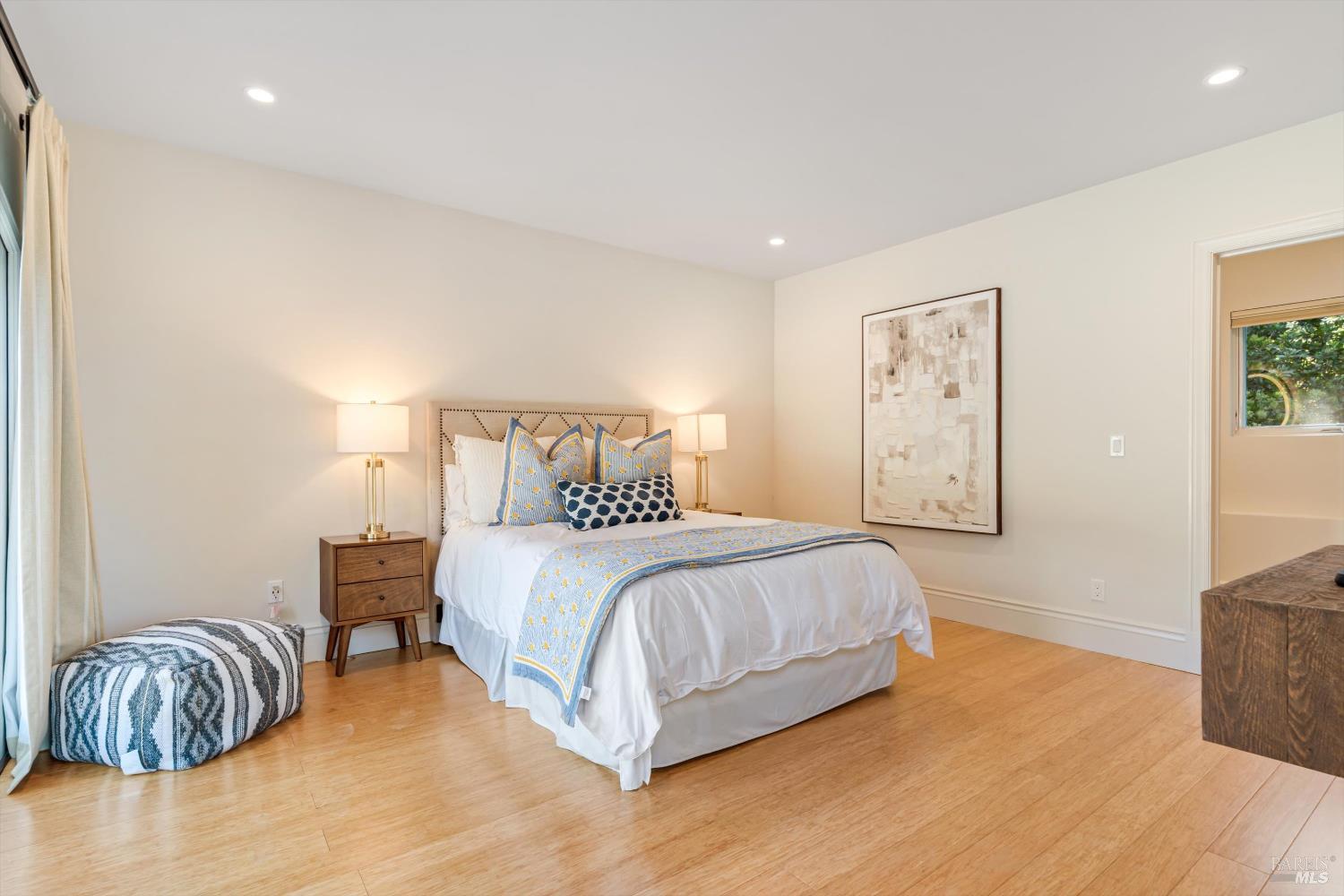 1315 West Dry Creek Road Healdsburg, CA 95448 - Photo 34 of 57 a bedroom with a bed and a painting on the wall
