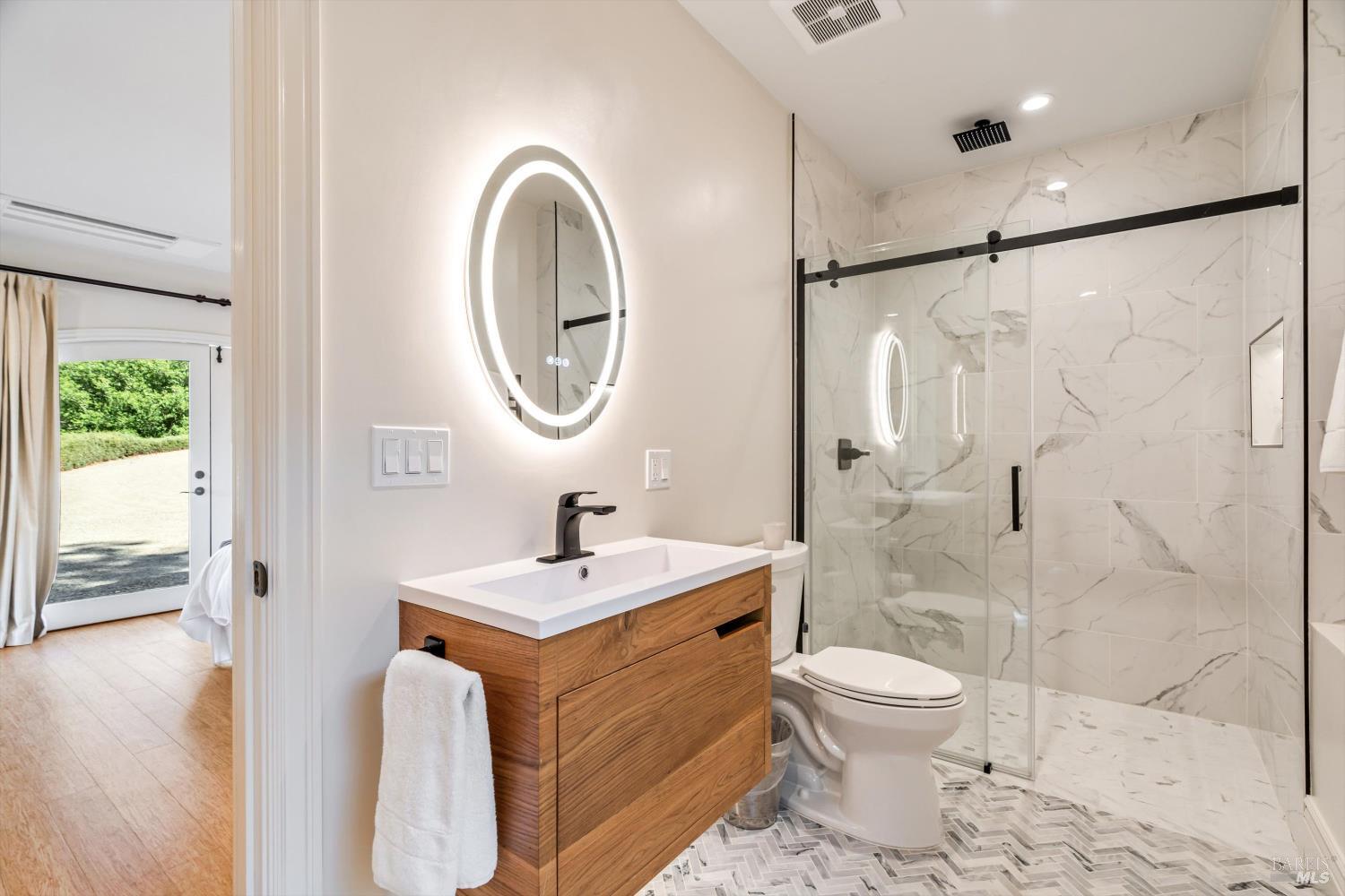 1315 West Dry Creek Road Healdsburg, CA 95448 - Photo 35 of 57 a bathroom with a sink toilet and shower