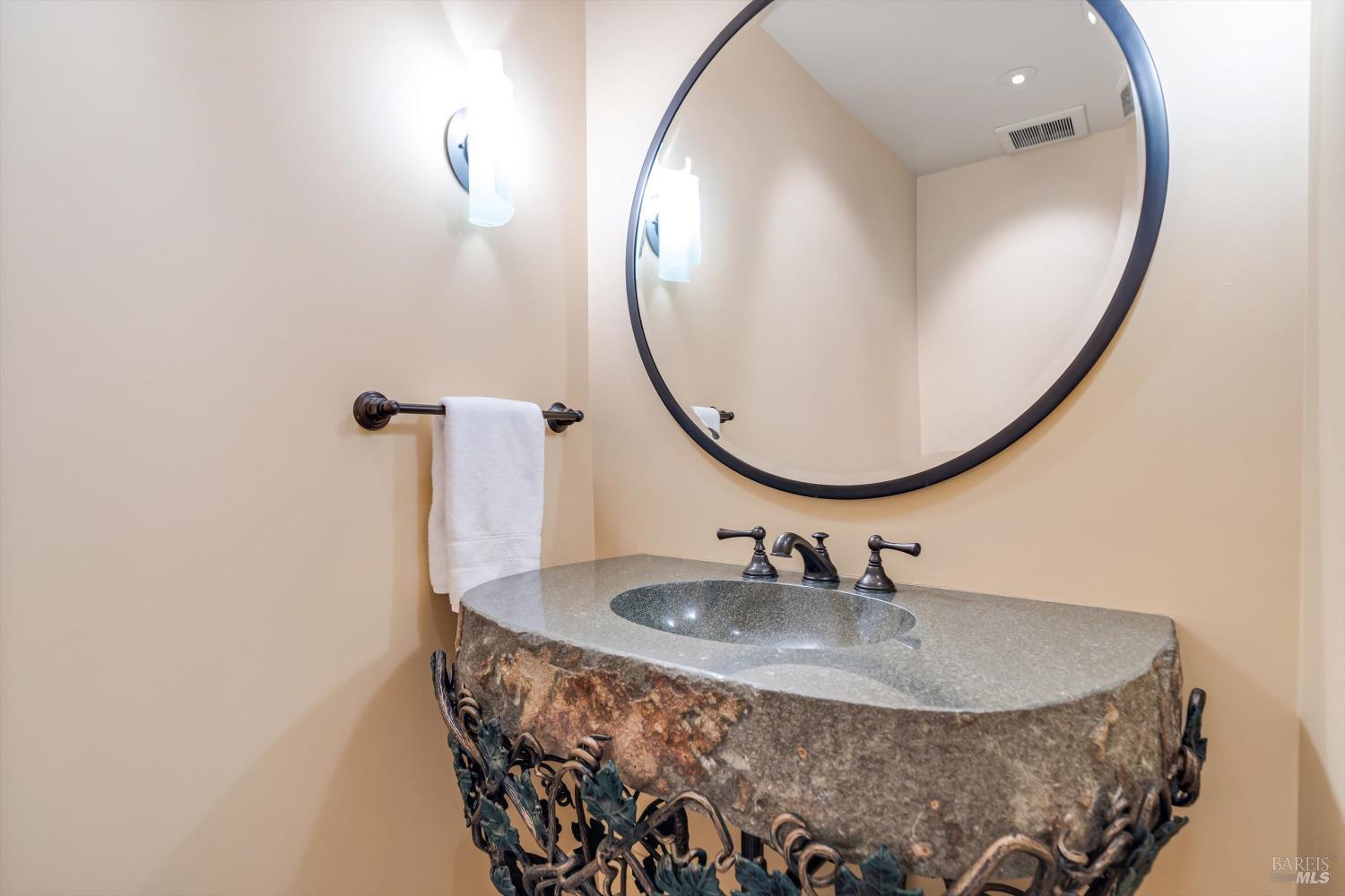 1315 West Dry Creek Road Healdsburg, CA 95448 - Photo 43 of 57 a bathroom with a sink and a mirror