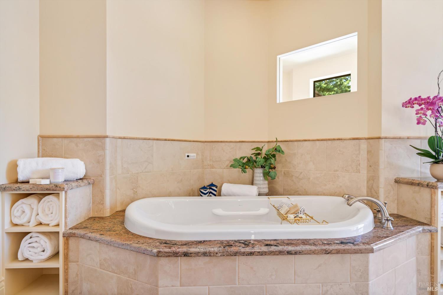 1315 West Dry Creek Road Healdsburg, CA 95448 - Photo 44 of 57 a bathroom with a sink and a mirror